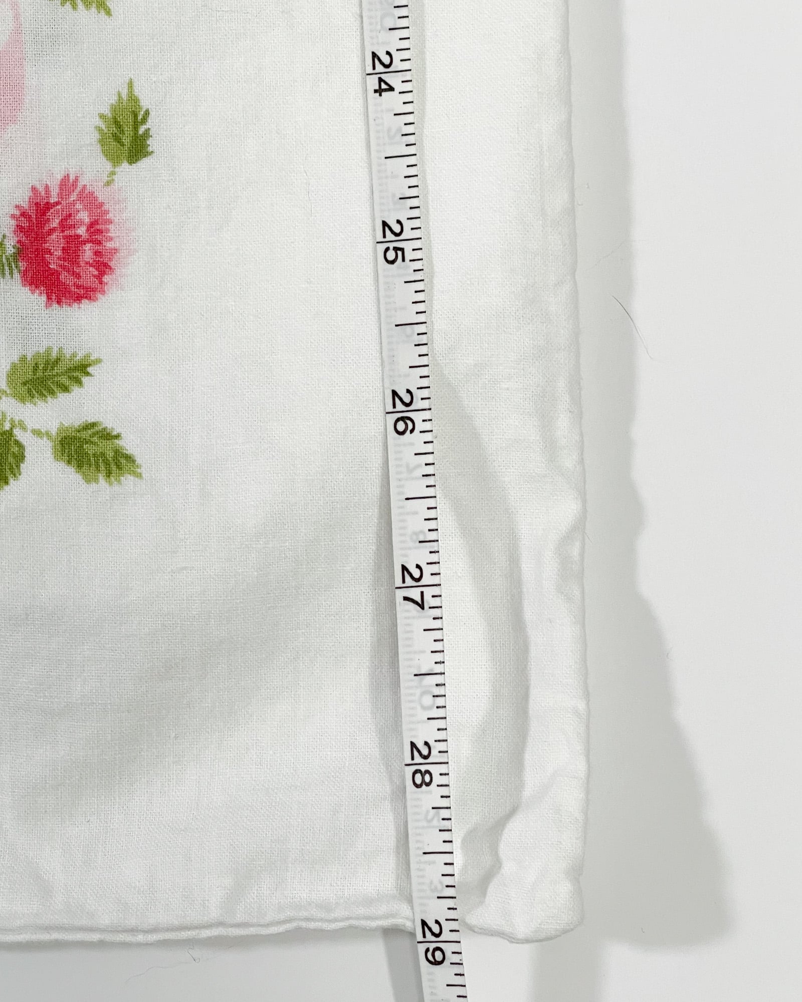 Vintage Springmaid Muslin pillowcase shown with measuring tape indicating 30 inch length