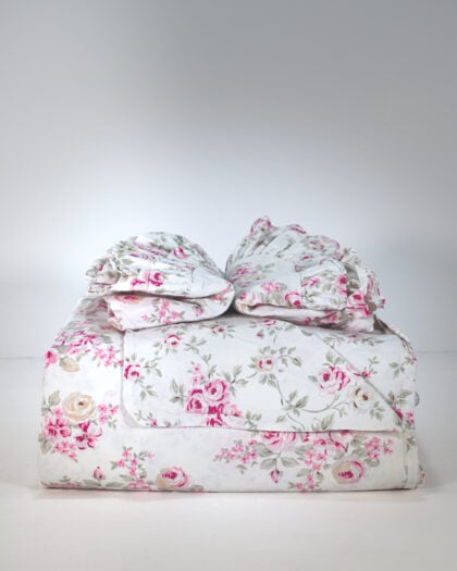 Simply Shabby Chic Blush Beauty queen duvet neatly folded with matching ruffled shams stacked front view