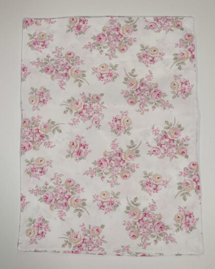Full flat lay of Simply Shabby Chic standard pillowcases with blush floral bouquet pattern on white