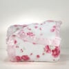 Simply Shabby Chic pink plush blanket neatly folded satin trim edge visible front view cabbage rose floral