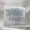 Simply Shabby Chic care tag backside 100% cotton RN 17730 Target label close-up on flat sheet