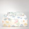 Yves Delorme Luxembourg Palais Royal Floral duvet cover front view folded with matching shams stacked reversible edge showing