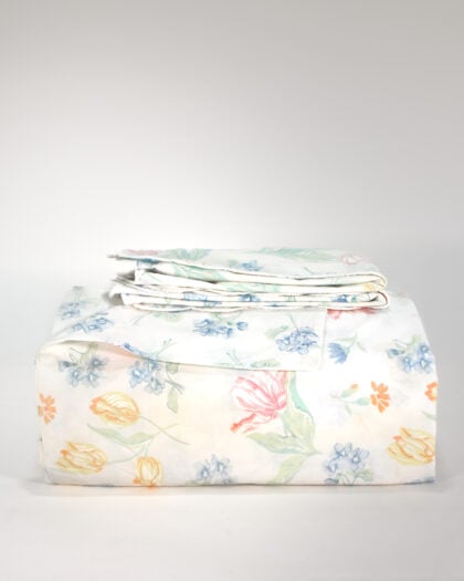 Yves Delorme Luxembourg Palais Royal Floral duvet cover front view folded with matching shams stacked reversible edge showing