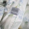 Yves Delorme Luxembourg Palais Royal Floral duvet cover reverse tag 100 percent cotton Made in France care label close-up