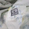 Yves Delorme Luxembourg Palais Royal Floral duvet cover Yves Delorme tag swan logo close-up