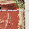 Measurement detail of vintage Saison Happily Married atomic barkcloth fabric shown with tape for size reference 46" wide