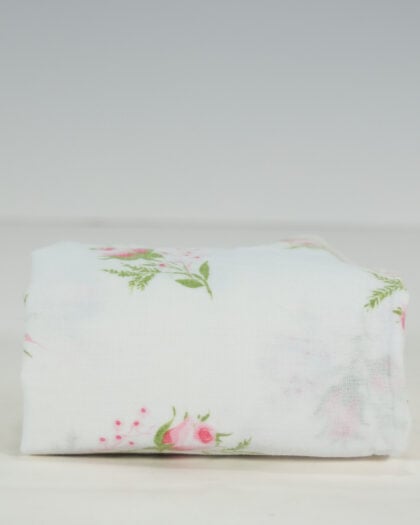 Folded vintage single pillowcase in white cotton with scattered pink rosebud floral print