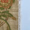 Top-down view of Schumacher Aragon Panel fabric remnant showing selvedge edge with Exclusive Schumacher Screen Print marking