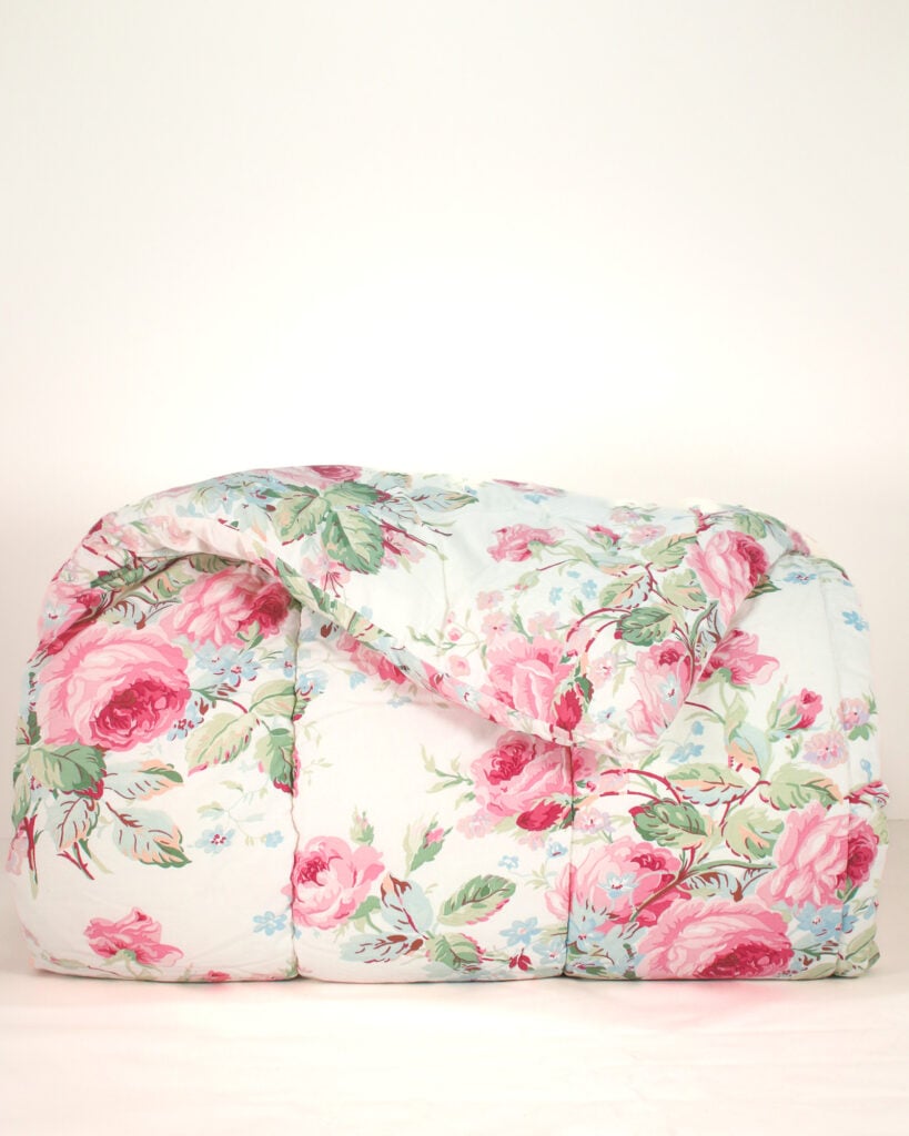 Front view of neatly styled Ralph Lauren Water Floral Pink queen comforter showing soft floral pattern and pastel bedding design