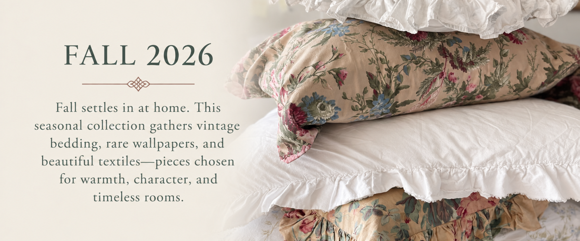 Fall 2026 vintage bedding collection with stacked floral quilts and white ruffled linens